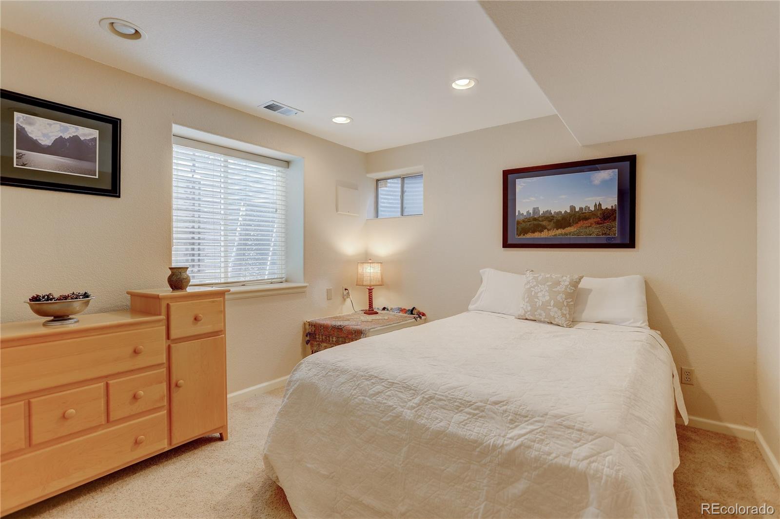 431 Mountain Chickadee Road Highlands Ranch, CO 80126 - Photo 31 of 38 a bedroom with a bed and a window