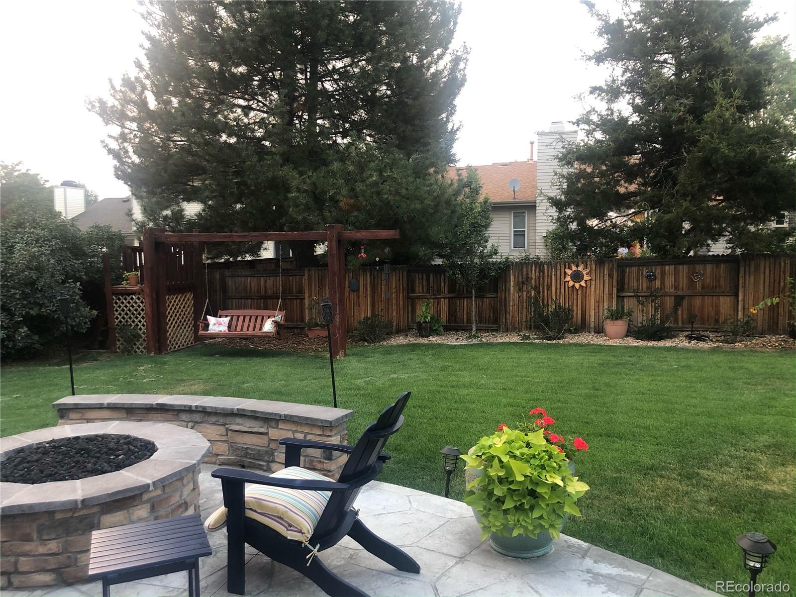 431 Mountain Chickadee Road Highlands Ranch, CO 80126 - Photo 34 of 38 a view of a chair and table in the garden