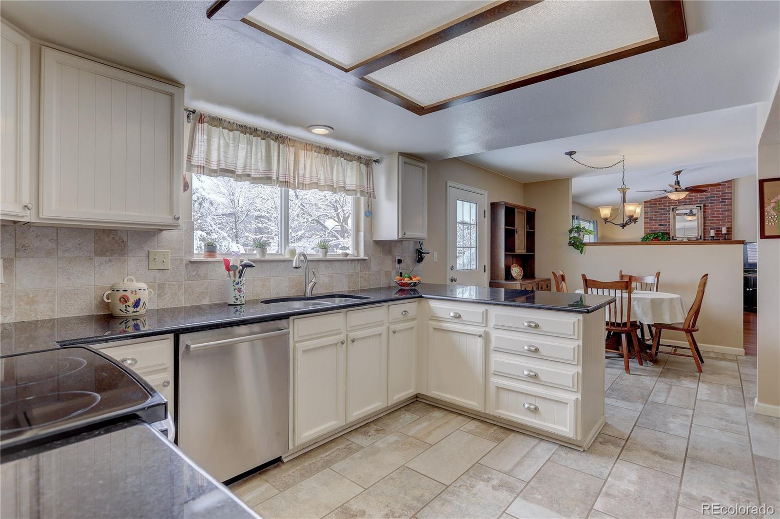 431 Mountain Chickadee Road Highlands Ranch, CO 80126 - Photo 6 of 38 a kitchen with sink and window