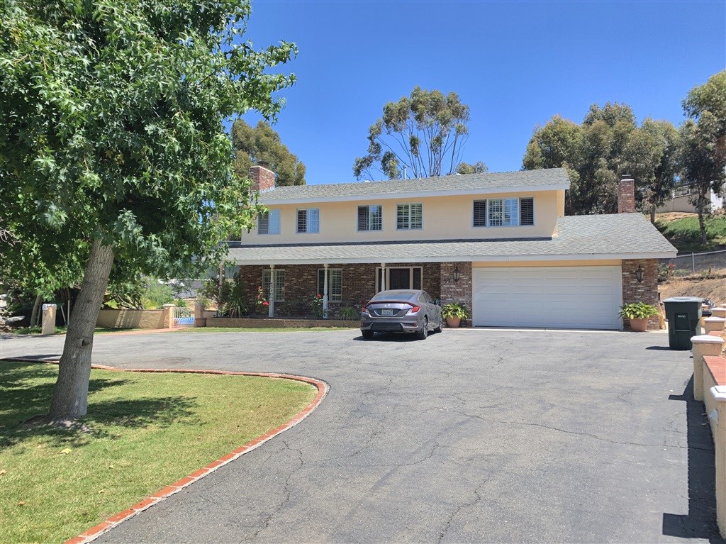 62 Pepper Tree Road Chula Vista, CA 91910 - Photo 1 of 17 a view of a house with swimming pool and a yard
