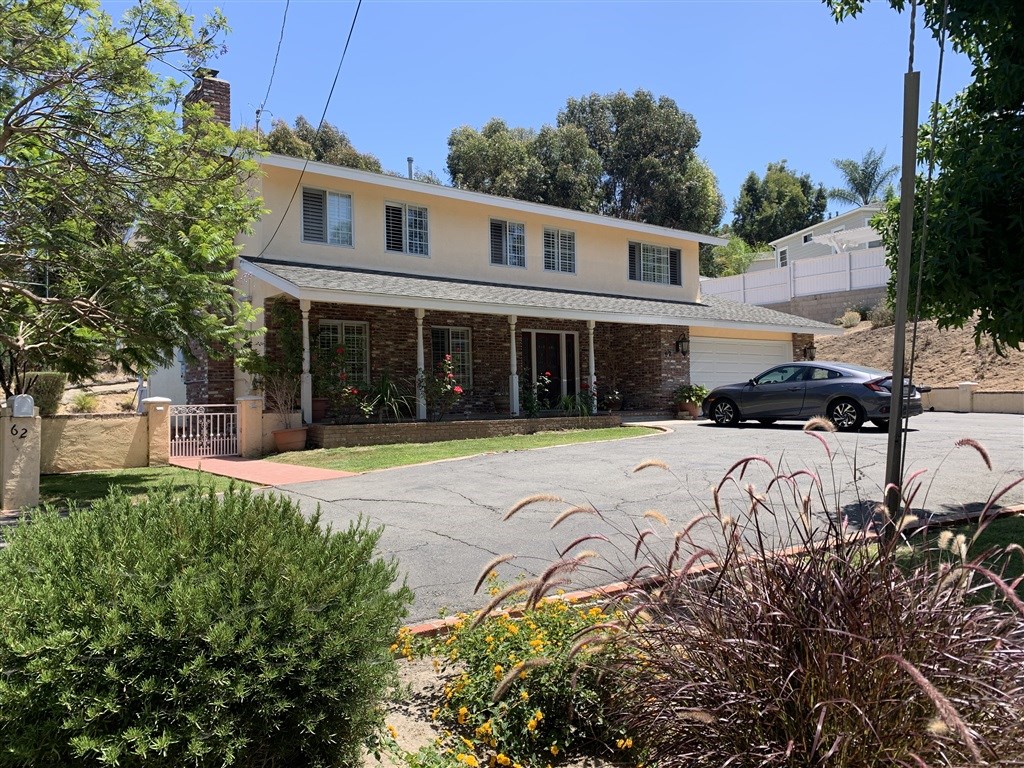 62 Pepper Tree Road Chula Vista, CA 91910 - Photo 2 of 17 a view of a house with swimming pool