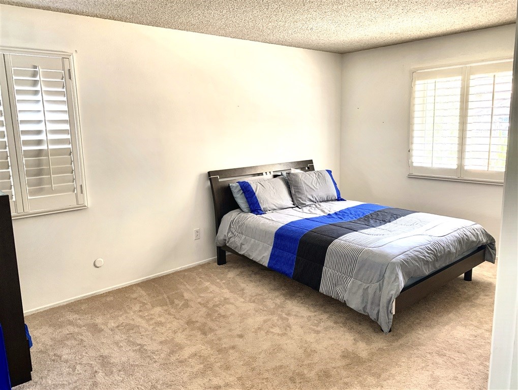62 Pepper Tree Road Chula Vista, CA 91910 - Photo 15 of 17 a bedroom with a bed and a window