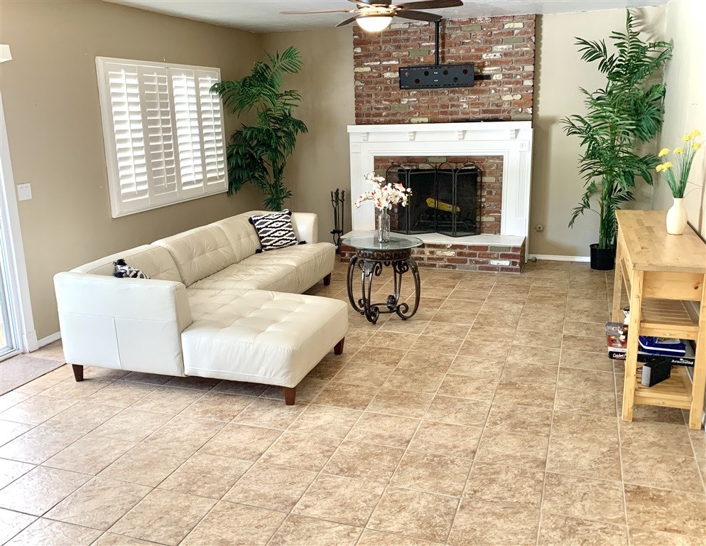 62 Pepper Tree Road Chula Vista, CA 91910 - Photo 6 of 17 a living room with furniture and a fireplace