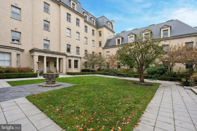 a front view of a building with garden