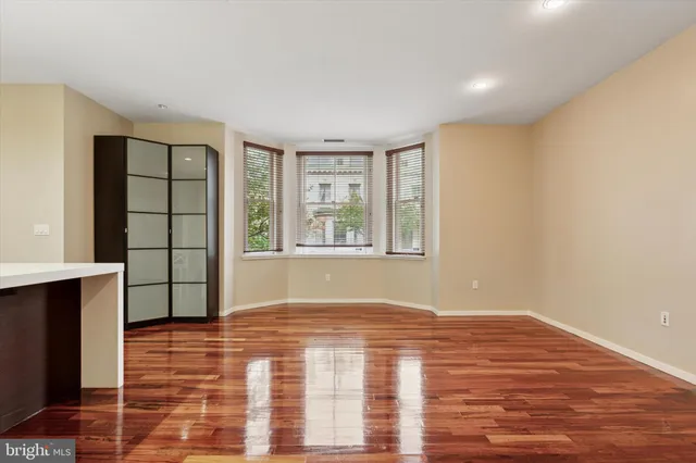 a kitchen with kitchen island a sink stainless steel appliances and cabinets