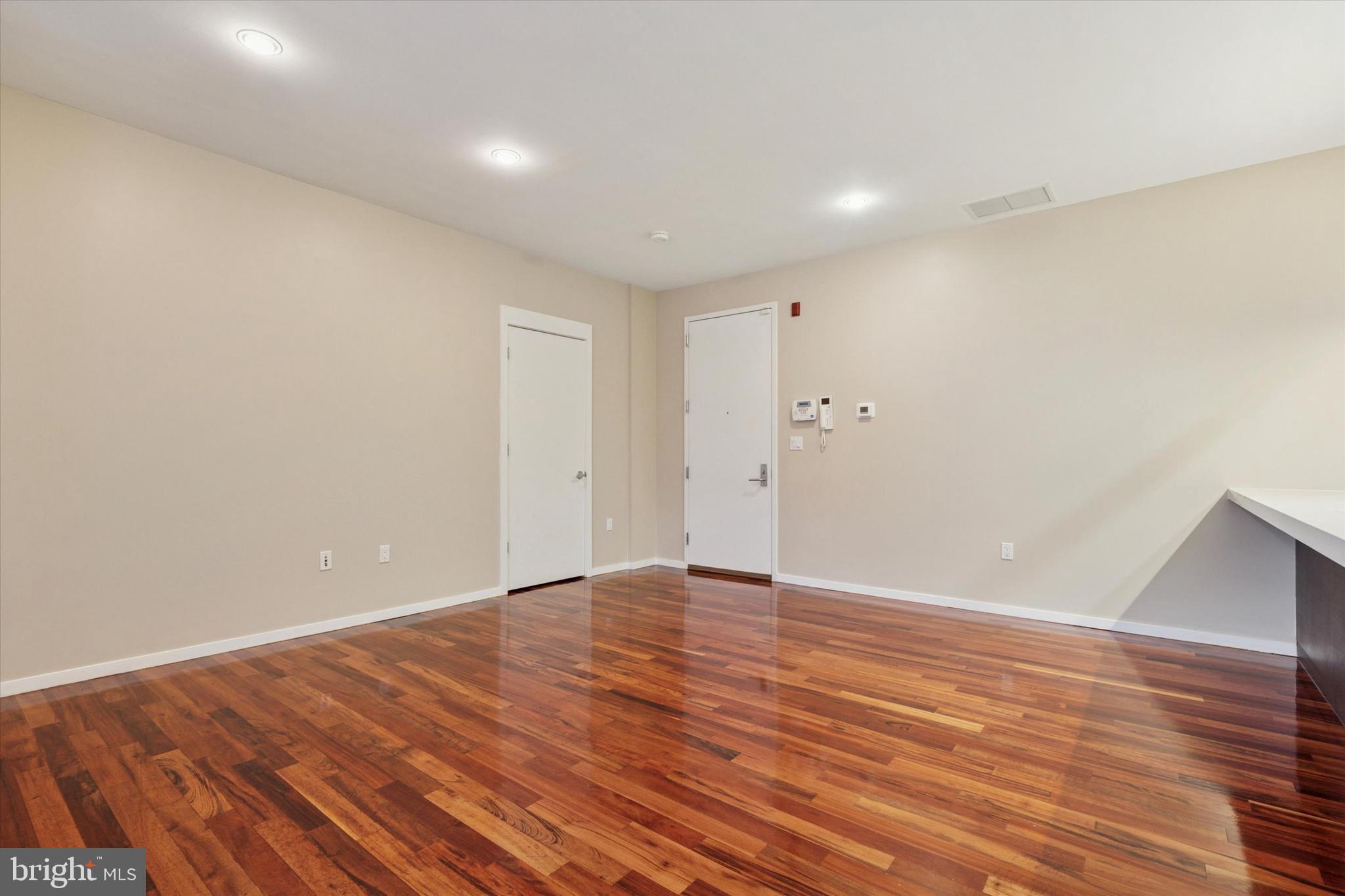 4200 Pine Street, Unit 103 Philadelphia, PA 19104 - Photo 18 of 35 a view of an empty room with wooden floor