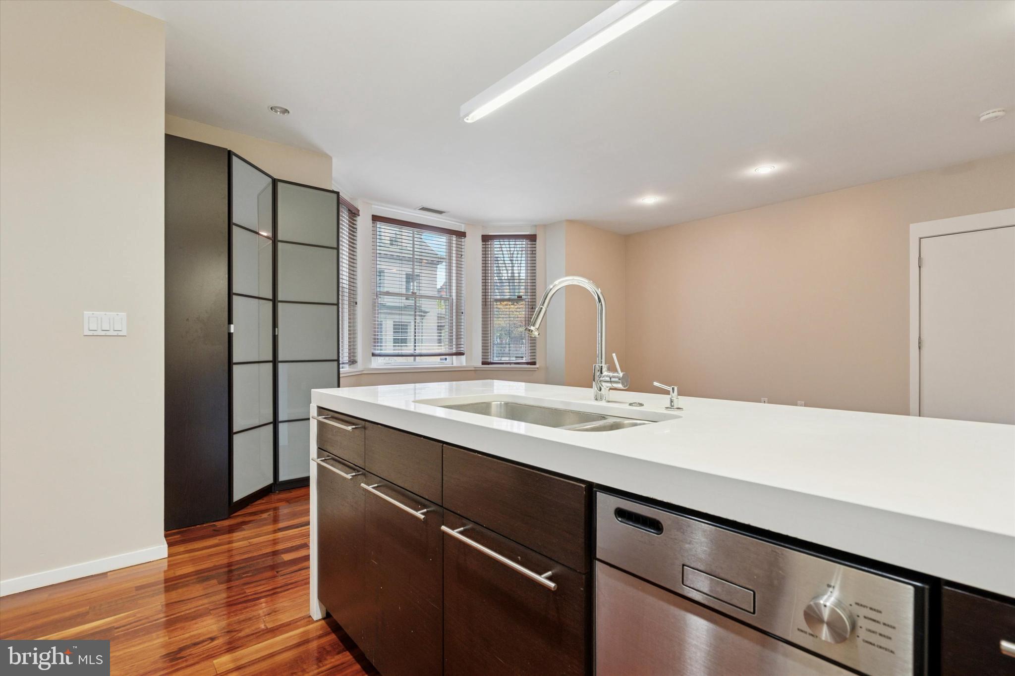 4200 Pine Street, Unit 103 Philadelphia, PA 19104 - Photo 23 of 35 a kitchen with a sink and wooden floor