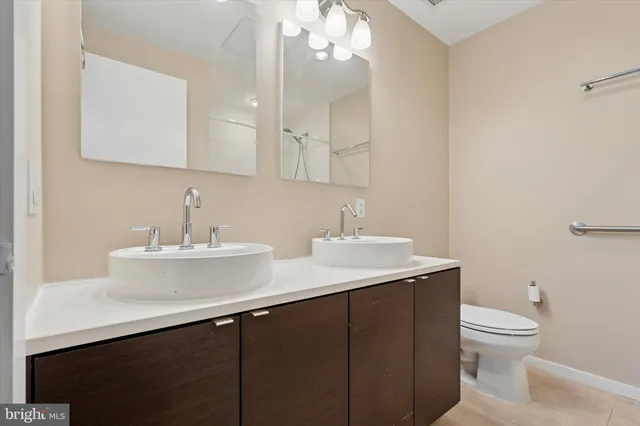 a bathroom with a bath tub with a shower
