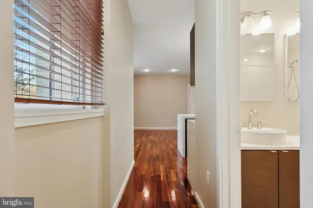 a view of a room with wooden floor