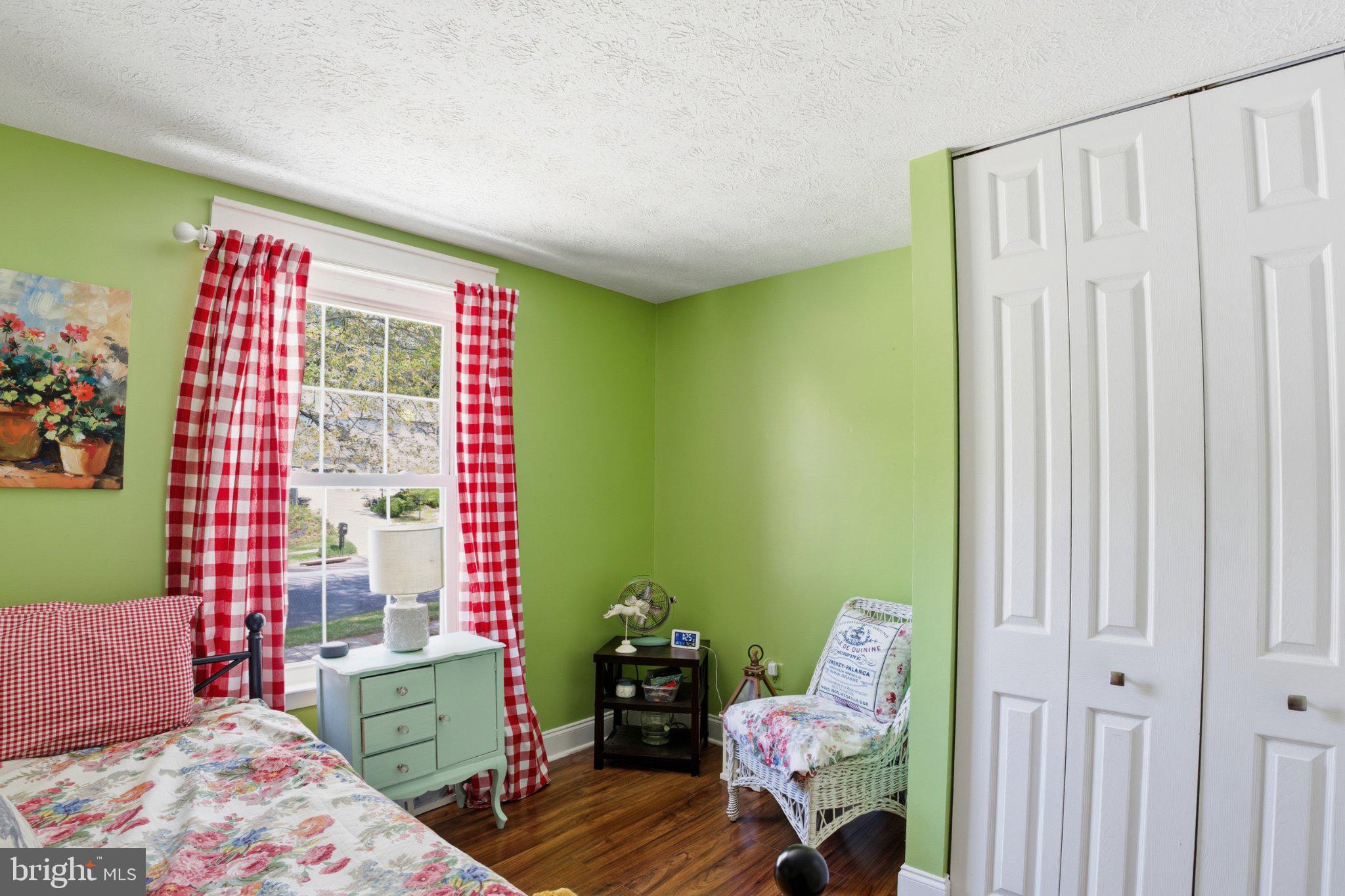 291 Waycross Way Arnold, MD 21012 - Photo 18 of 34 Charming green bedroom with cozy decor.