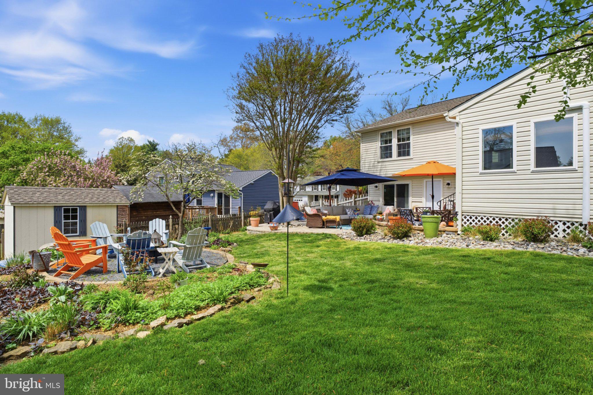 291 Waycross Way Arnold, MD 21012 - Photo 27 of 34 Lush backyard oasis with vibrant blooms.
