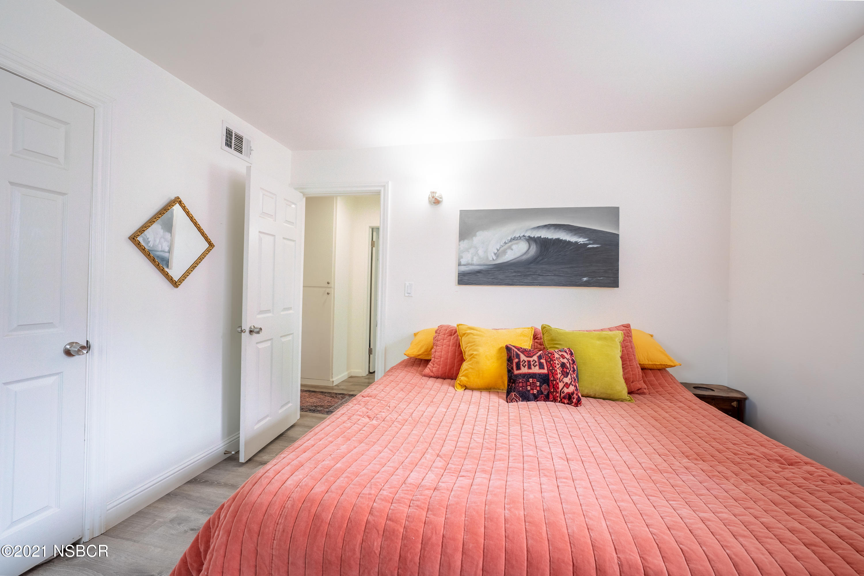 3985 Constellation Road Lompoc, CA 93436 - Photo 17 of 25 a bedroom with a bed and painting on the wall