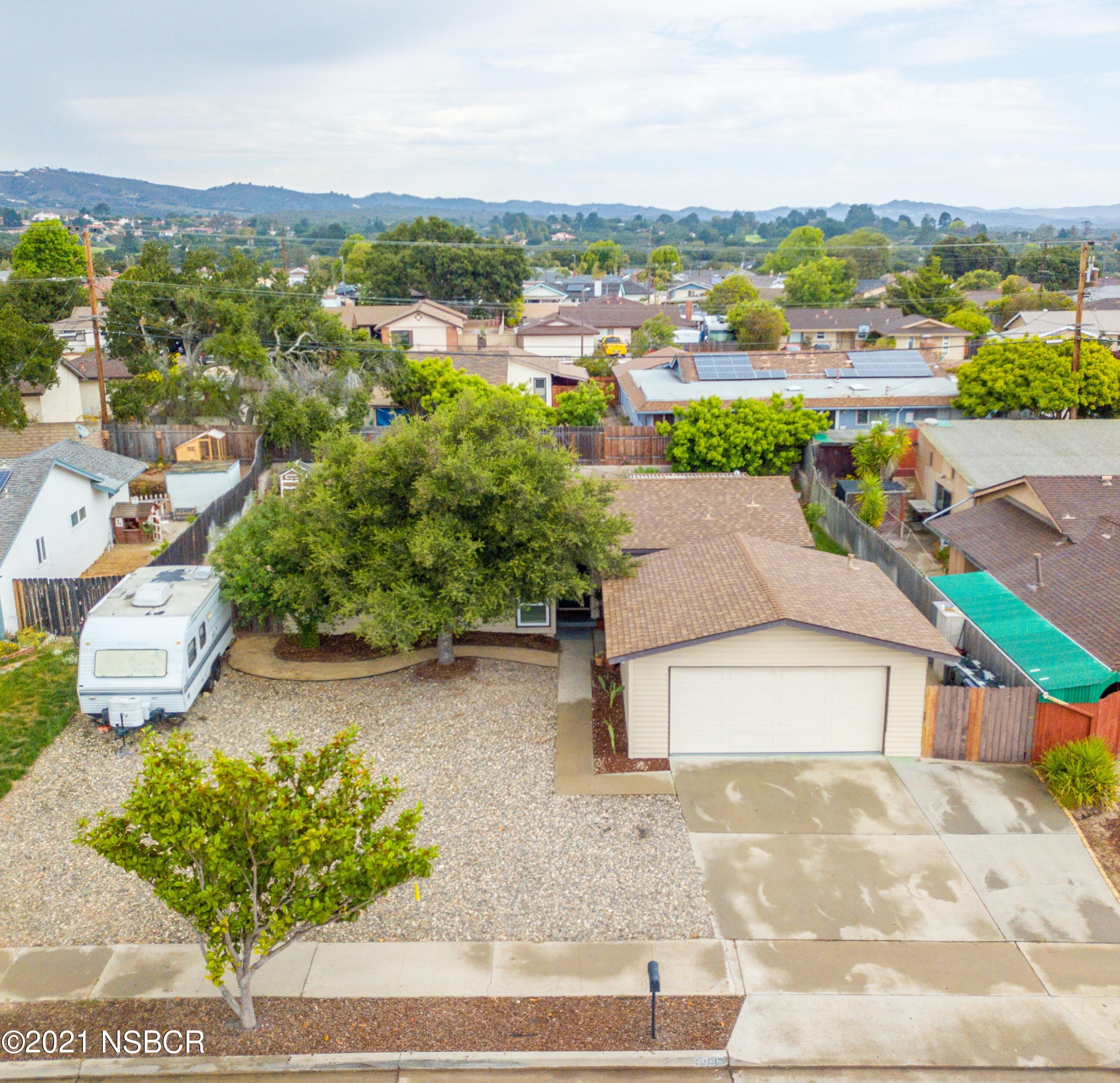 3985 Constellation Road Lompoc, CA 93436 - Photo 2 of 25 an aerial view of residential houses with outdoor space