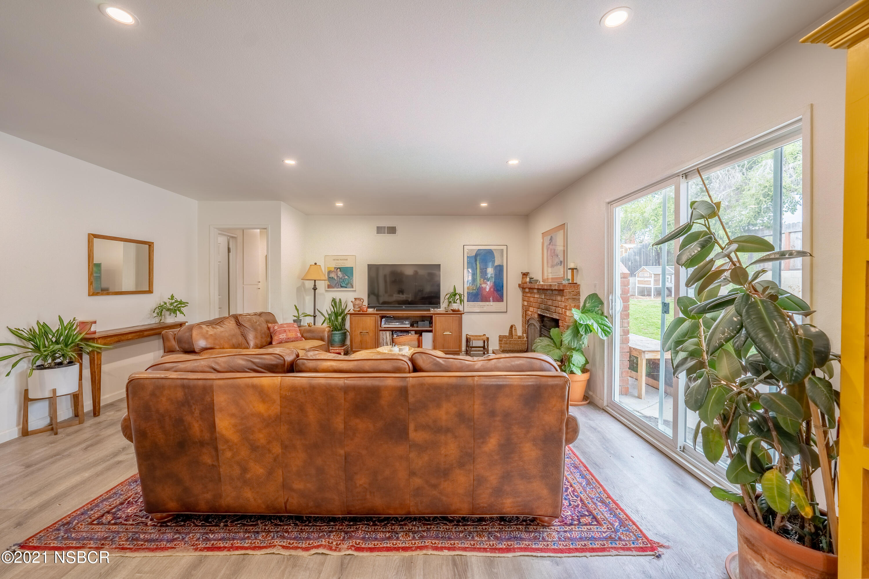 3985 Constellation Road Lompoc, CA 93436 - Photo 6 of 25 a living room with furniture a large window and a rug