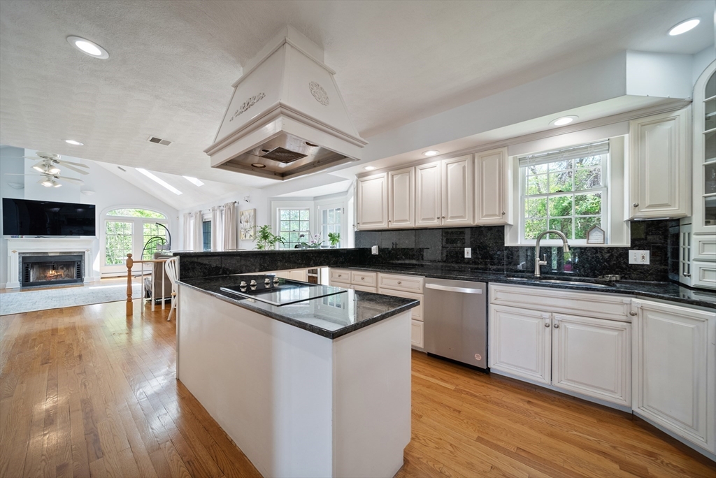 87 Hammersmith Drive Saugus, MA 01906 - Photo 14 of 37 a kitchen with stainless steel appliances granite countertop a stove a sink and a microwave