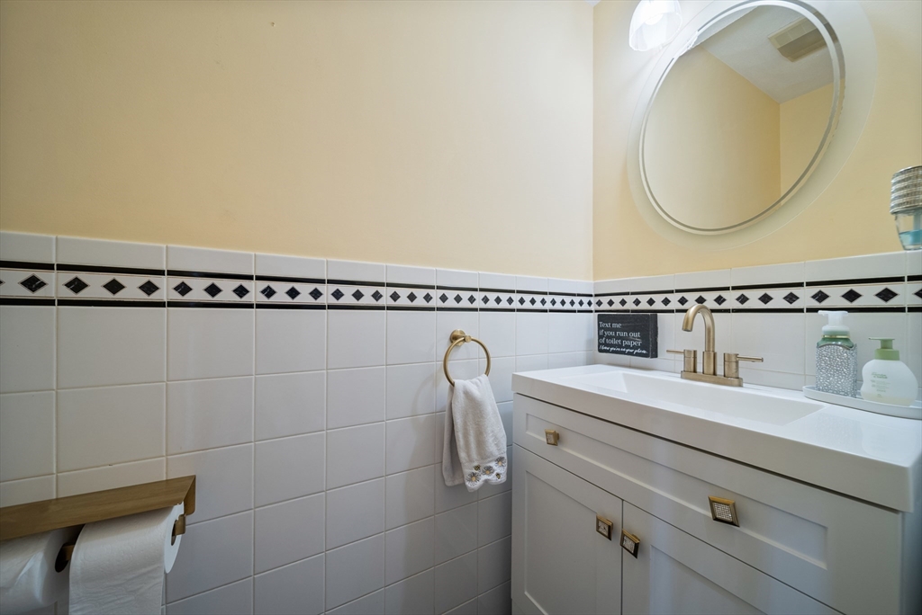 87 Hammersmith Drive Saugus, MA 01906 - Photo 20 of 37 a bathroom with a sink and a mirror
