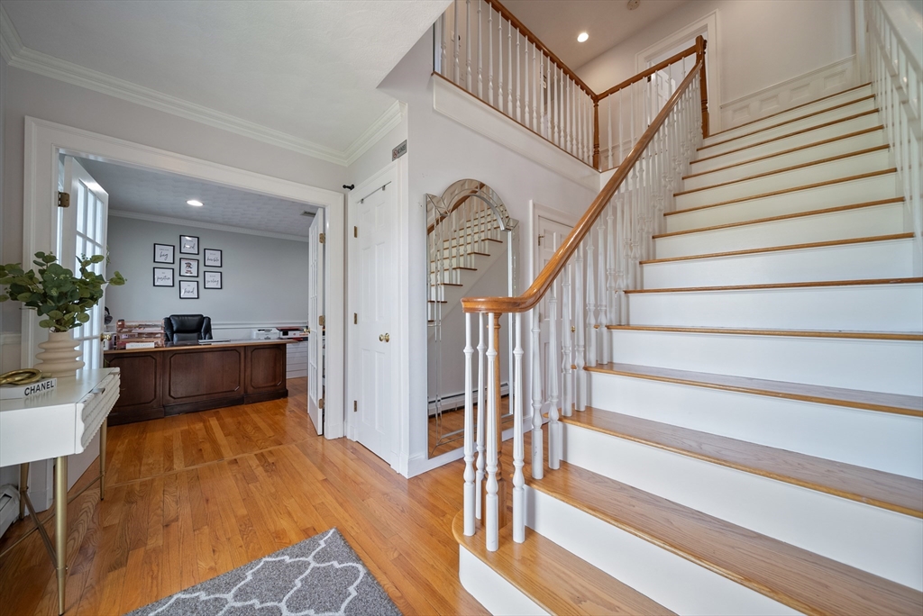 87 Hammersmith Drive Saugus, MA 01906 - Photo 22 of 37 a view of entryway and hall with wooden floor