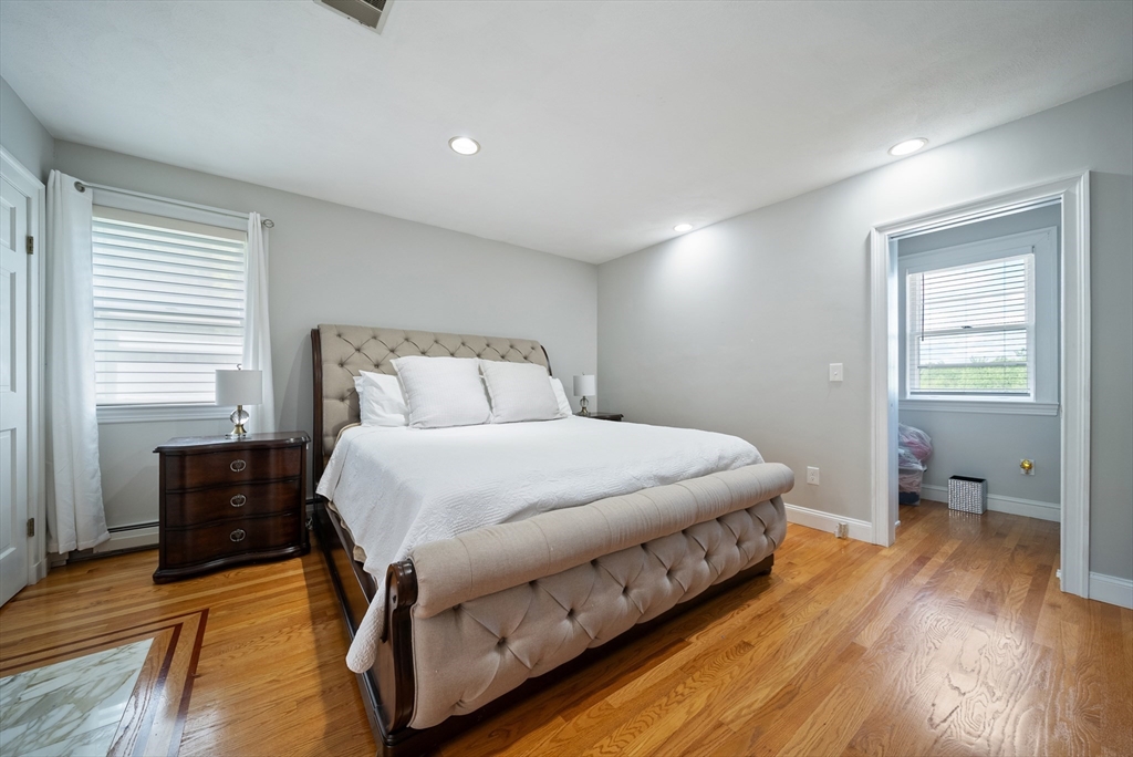 87 Hammersmith Drive Saugus, MA 01906 - Photo 25 of 37 a bedroom with a bed and wooden floor