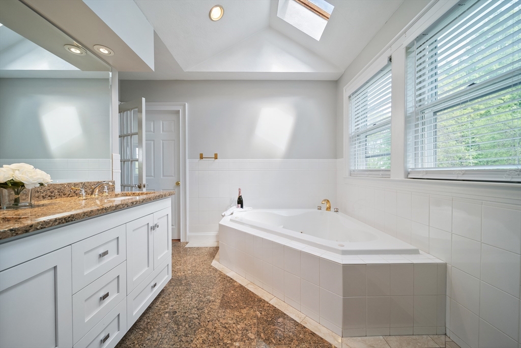 87 Hammersmith Drive Saugus, MA 01906 - Photo 27 of 37 a bathroom with a sink and a bathtub