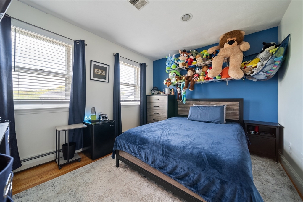 87 Hammersmith Drive Saugus, MA 01906 - Photo 30 of 37 a bedroom with a bed and a window