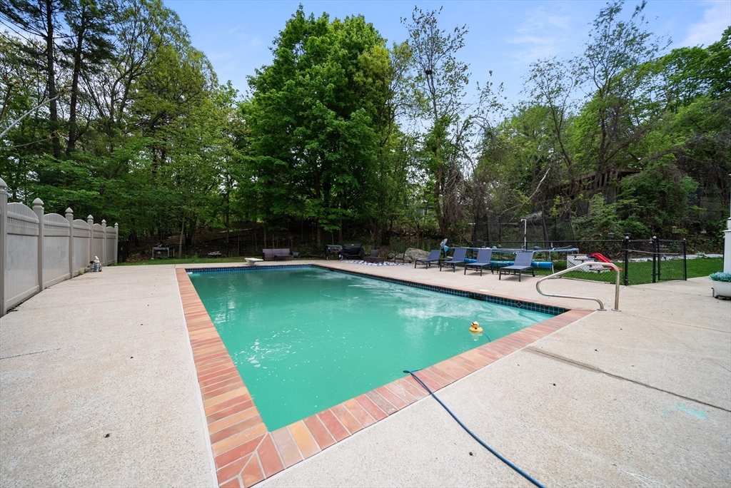 87 Hammersmith Drive Saugus, MA 01906 - Photo 34 of 37 a view of a swimming pool with a patio