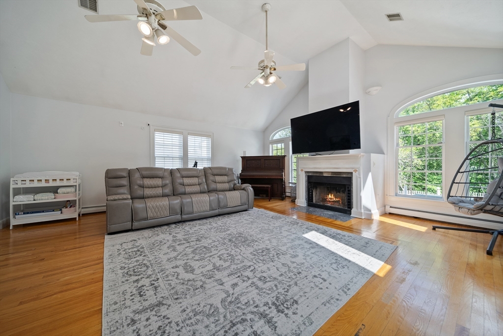 87 Hammersmith Drive Saugus, MA 01906 - Photo 7 of 37 a living room with furniture fireplace and flat screen tv