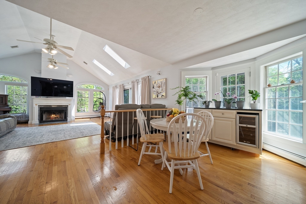 87 Hammersmith Drive Saugus, MA 01906 - Photo 8 of 37 a dining room with furniture a fireplace and wooden floor