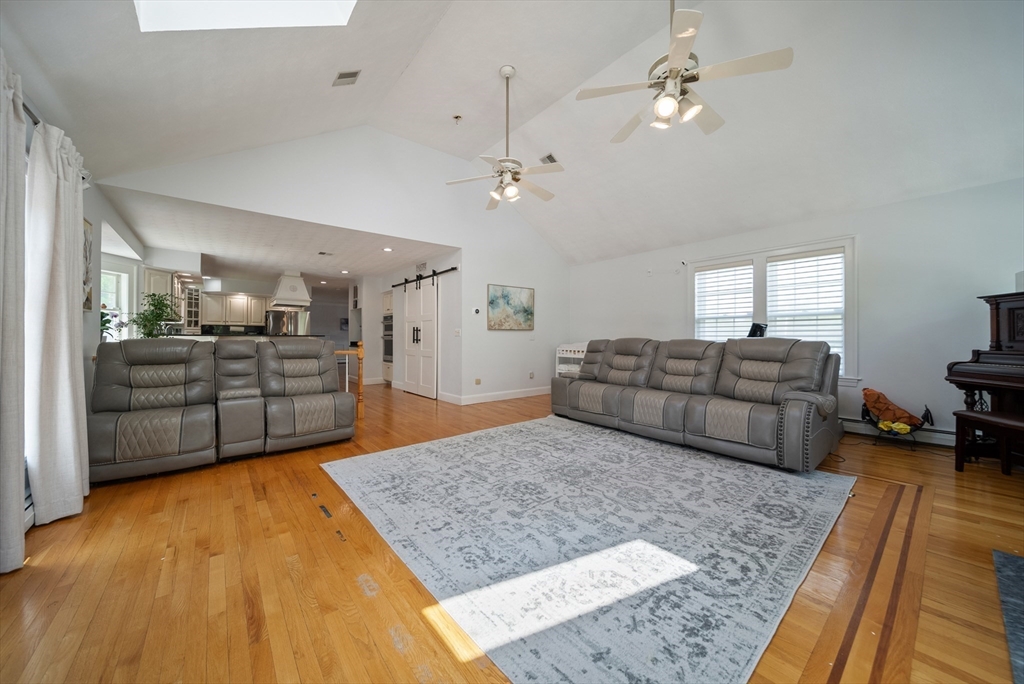 87 Hammersmith Drive Saugus, MA 01906 - Photo 9 of 37 a living room with furniture and a rug