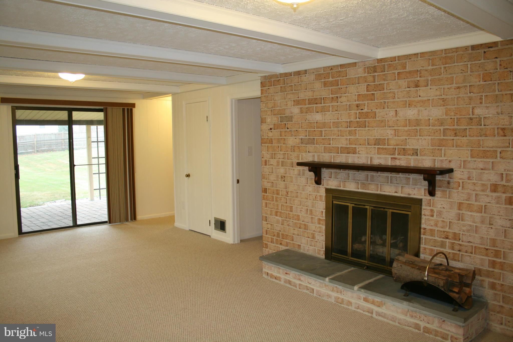 19116 Bloomfield Road Olney, MD 20832 - Photo 17 of 25 a view of empty room with a fireplace