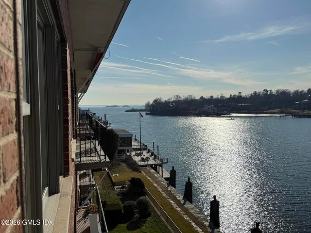 a view of a city with lawn chairs