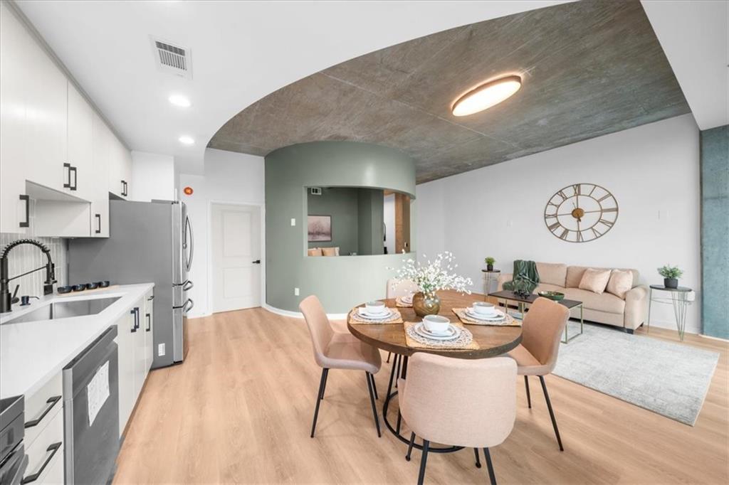 250 Pharr Road Northeast, Unit 704 Atlanta, GA 30305 - Photo 20 of 53 a view of a dining room with furniture
