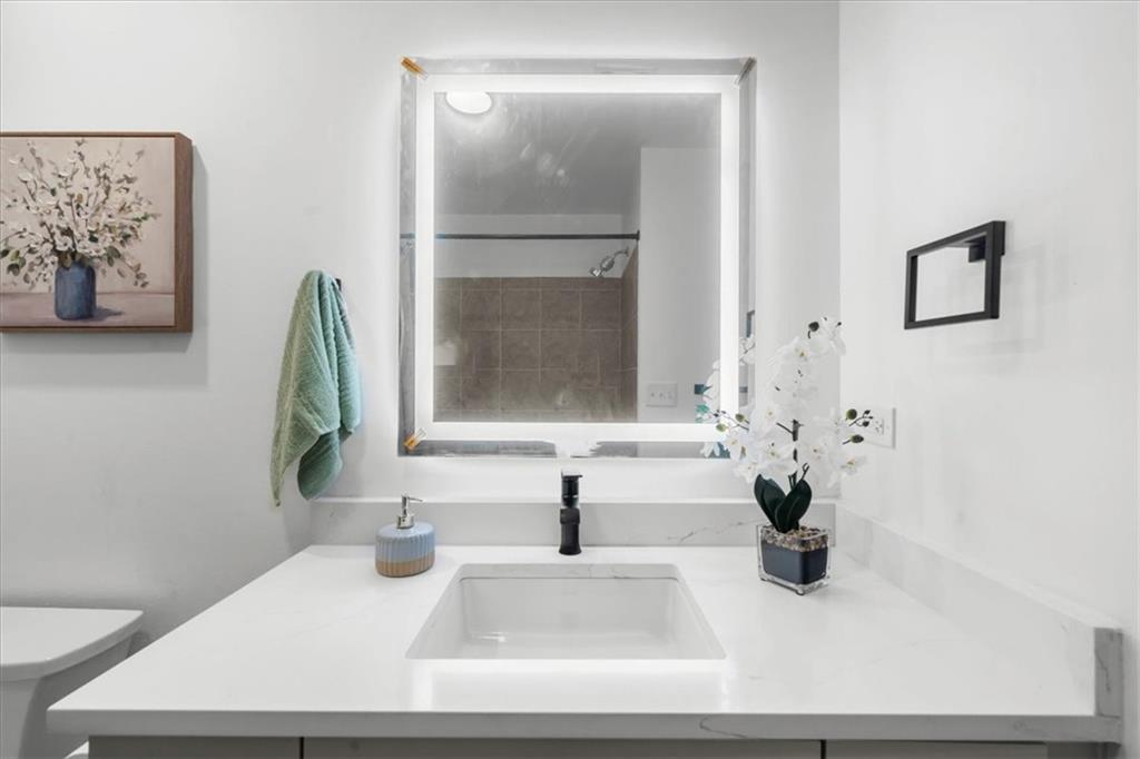 250 Pharr Road Northeast, Unit 704 Atlanta, GA 30305 - Photo 29 of 53 a bathroom with a sink