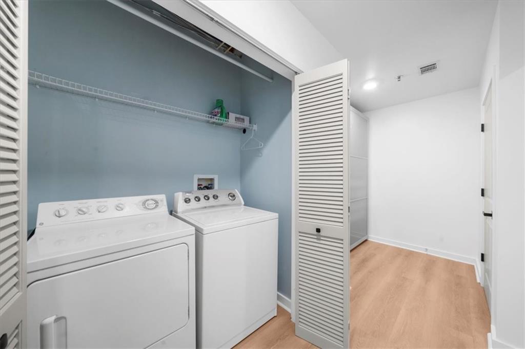 250 Pharr Road Northeast, Unit 704 Atlanta, GA 30305 - Photo 34 of 53 a utility room with dryer and washer