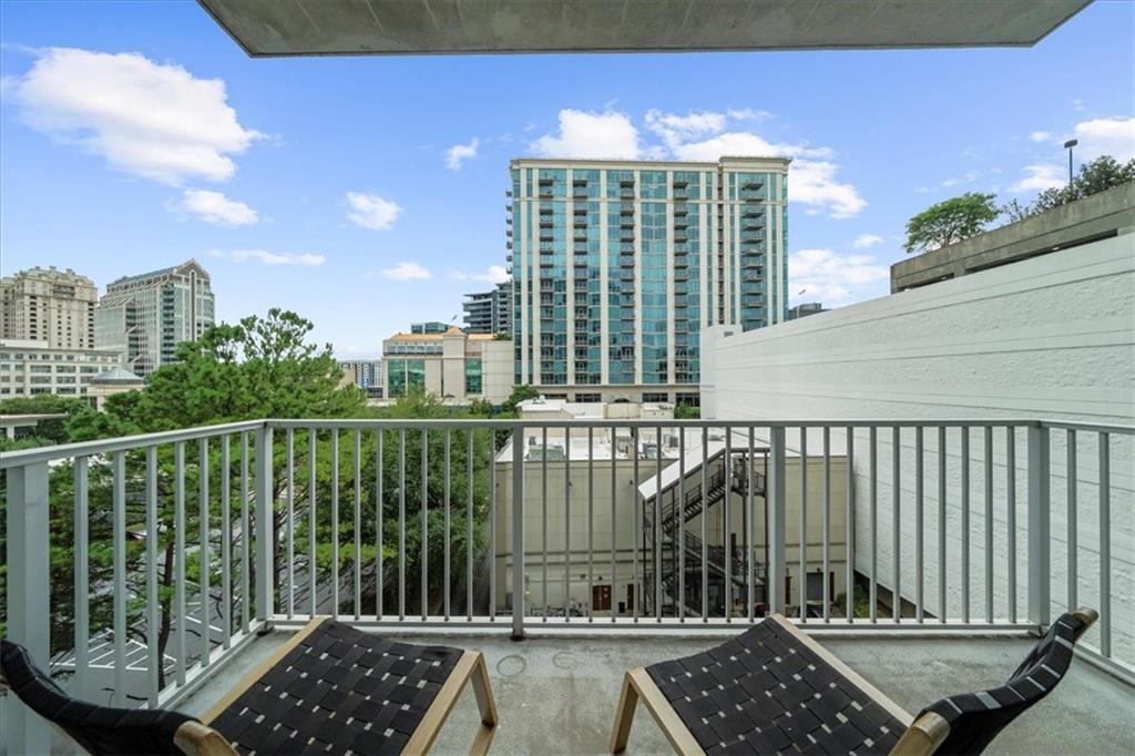 250 Pharr Road Northeast, Unit 704 Atlanta, GA 30305 - Photo 35 of 53 a view of balcony with a potted plant and outdoor seating