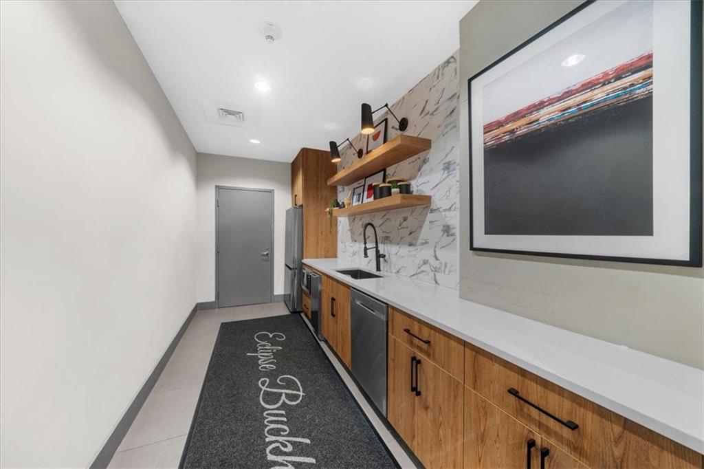 250 Pharr Road Northeast, Unit 704 Atlanta, GA 30305 - Photo 45 of 53 a hallway with cabinets