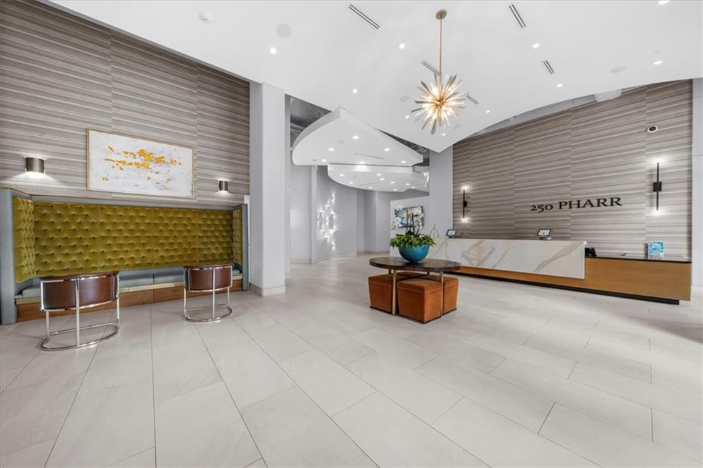 250 Pharr Road Northeast, Unit 704 Atlanta, GA 30305 - Photo 52 of 53 a lobby with furniture and a chandelier