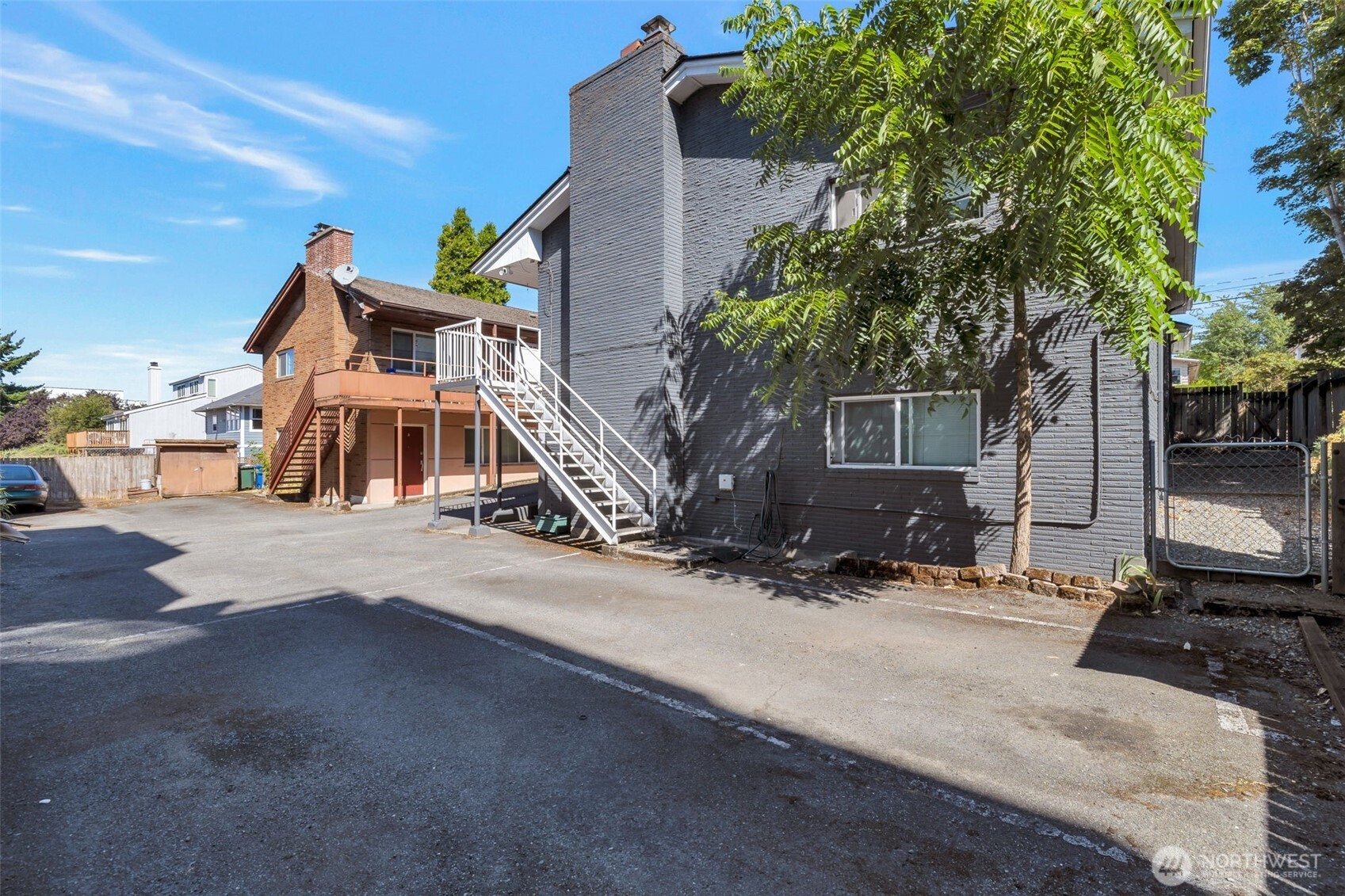 917 Northwest 57th Street Seattle, WA 98107 - Photo 7 of 23 a house with trees in front of it