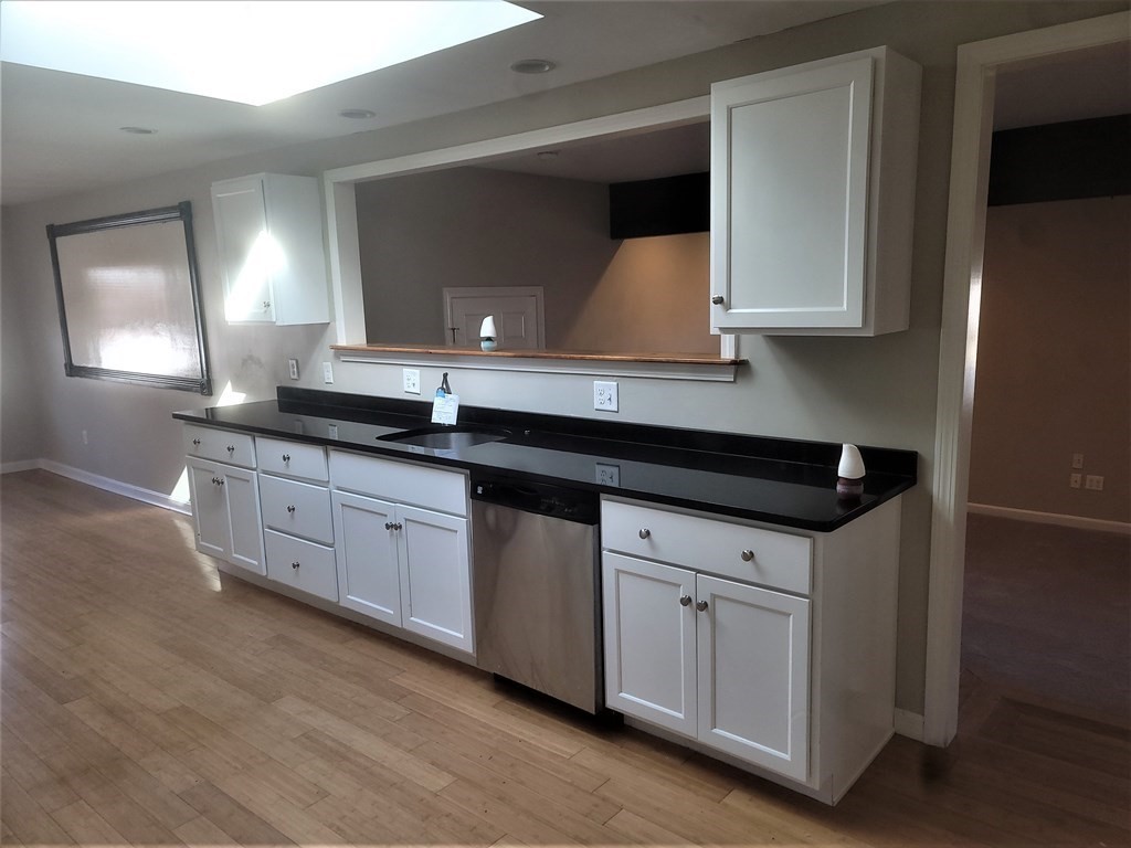 21 Kimball Road Amesbury, MA 01913 - Photo 15 of 23 a kitchen with granite countertop a sink and cabinets