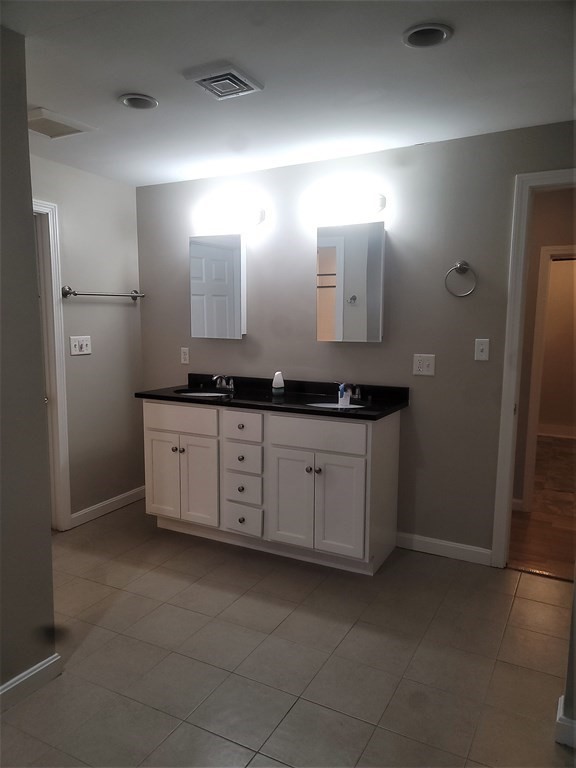 21 Kimball Road Amesbury, MA 01913 - Photo 19 of 23 a spacious bathroom with a granite countertop sink and a mirror