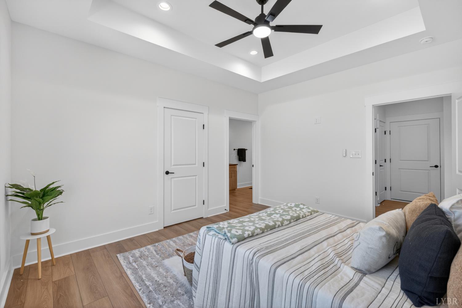 20 Fox Hall Drive Amherst, VA 24521 - Photo 24 of 46 a bedroom with a bed and a potted plant