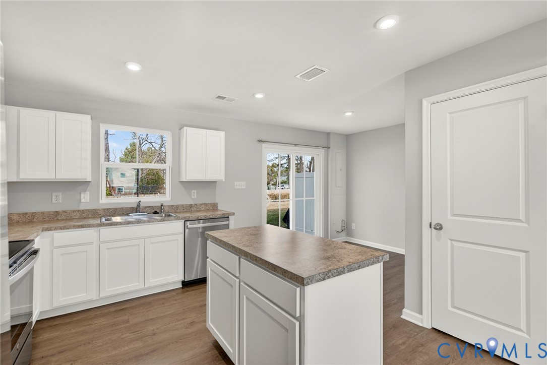 1136 Canterbury Ridge Road Richmond, VA 23224 - Photo 12 of 28 a kitchen with granite countertop a sink and cabinets