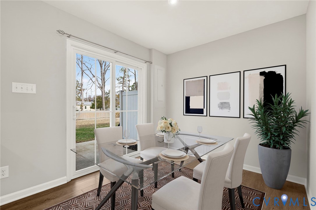 1136 Canterbury Ridge Road Richmond, VA 23224 - Photo 14 of 28 a view of a dining room with furniture window and wooden floor