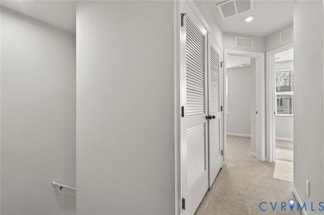 1136 Canterbury Ridge Road Richmond, VA 23224 - Photo 15 of 28 a view of a hallway with closet and bathroom