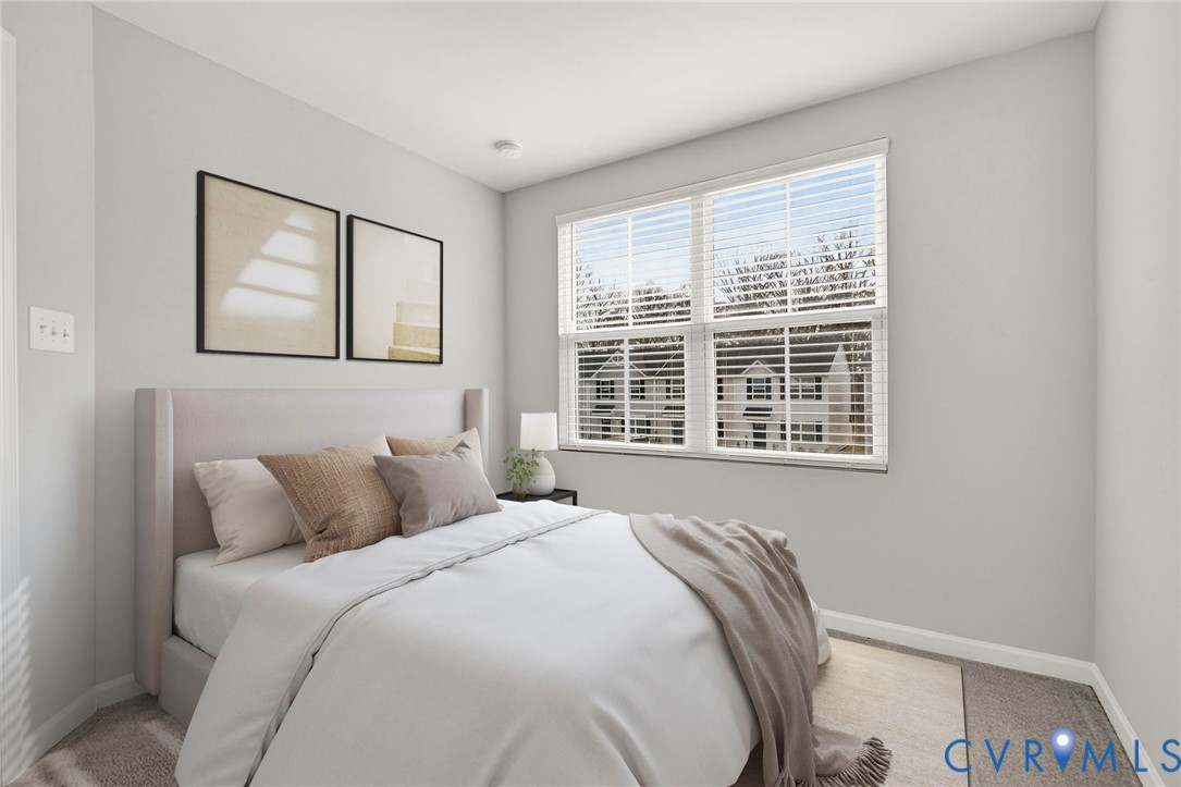 1136 Canterbury Ridge Road Richmond, VA 23224 - Photo 18 of 28 a bedroom with a bed and a large window