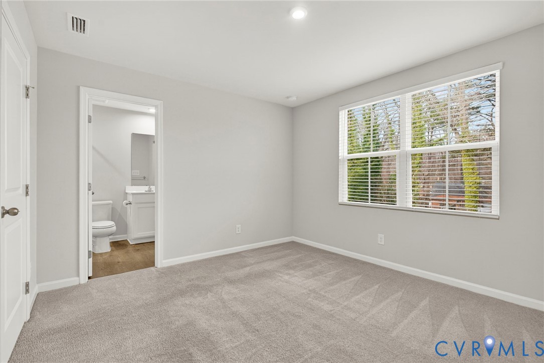 1136 Canterbury Ridge Road Richmond, VA 23224 - Photo 24 of 28 a view of an empty room with a window