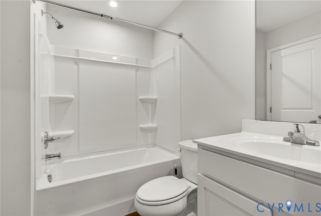 1136 Canterbury Ridge Road Richmond, VA 23224 - Photo 26 of 28 a bathroom with a sink toilet and shower