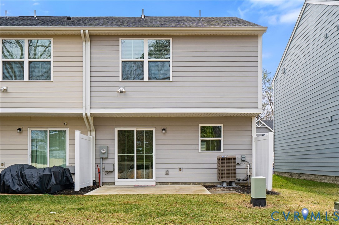 1136 Canterbury Ridge Road Richmond, VA 23224 - Photo 28 of 28 a view of a house with a yard