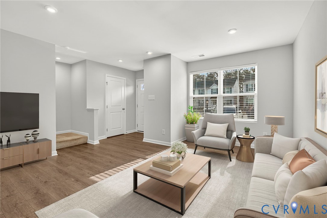1136 Canterbury Ridge Road Richmond, VA 23224 - Photo 6 of 28 a living room with furniture and a flat screen tv