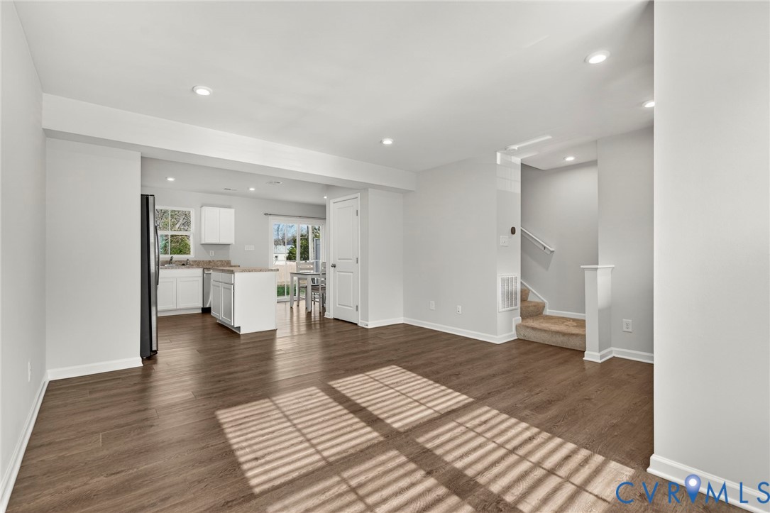 1136 Canterbury Ridge Road Richmond, VA 23224 - Photo 9 of 28 a view of open kitchen with white cabinets and sink