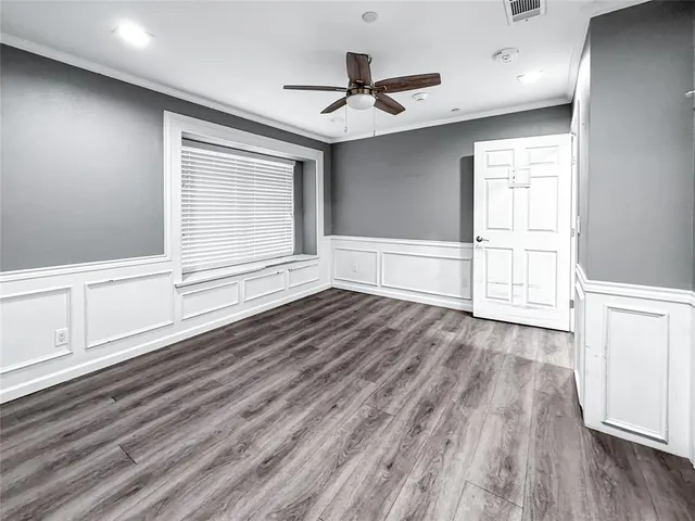 a kitchen with stainless steel appliances granite countertop a sink and a large window